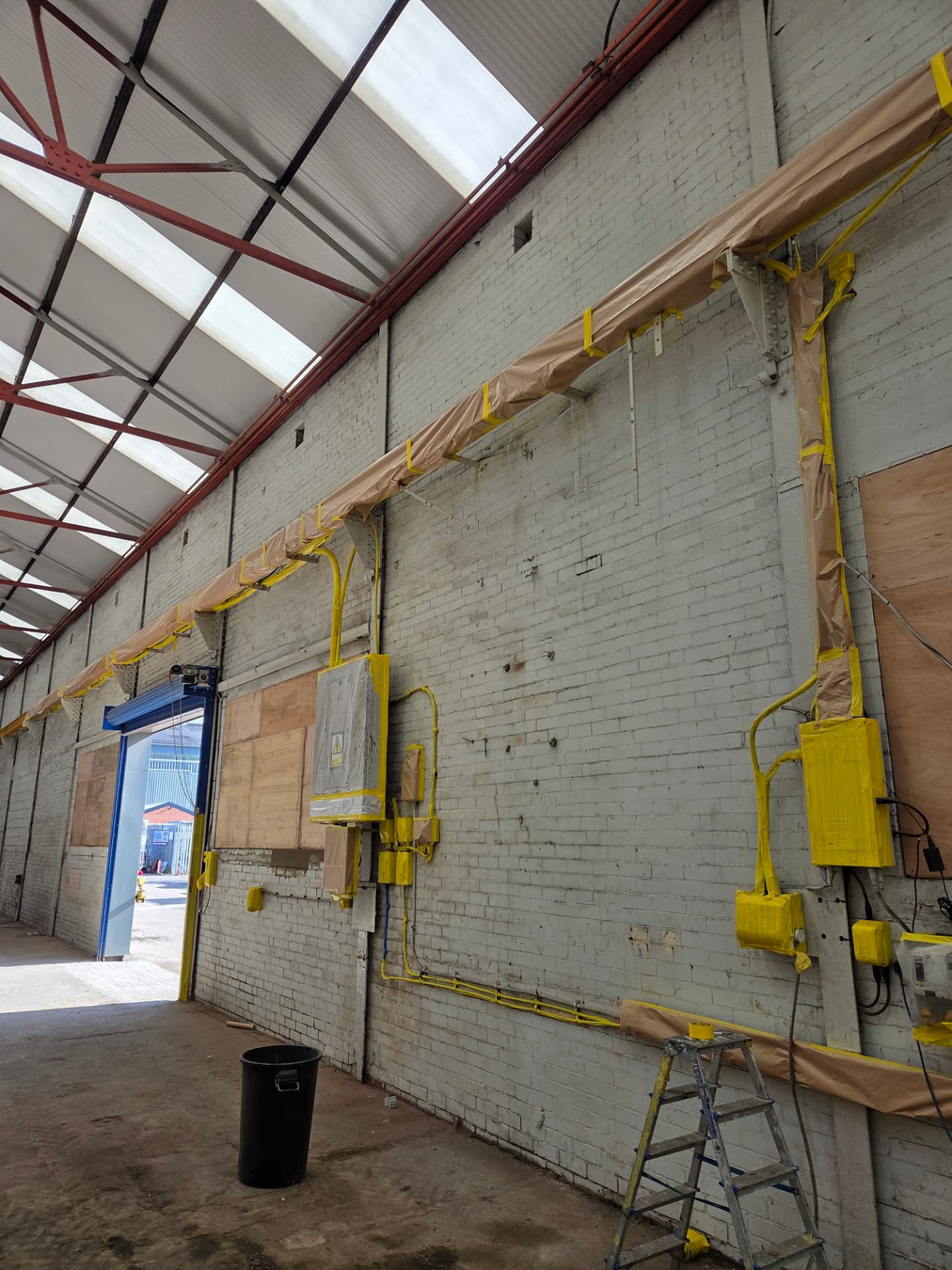 Company-supplied photograph of Wakefield warehouse services masked and protected during preparation