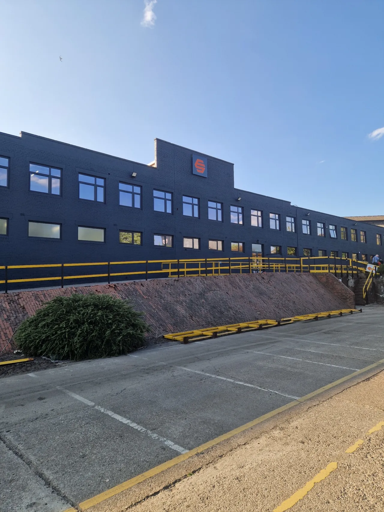 Completed Forged Solutions office block in Sheffield with exterior brickwork resprayed in RAL 7016 anthracite grey