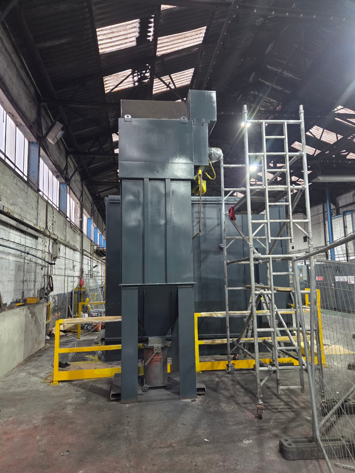 Company-supplied Forged Solutions photograph of the silo resprayed in RAL 7016 anthracite grey beside an access tower