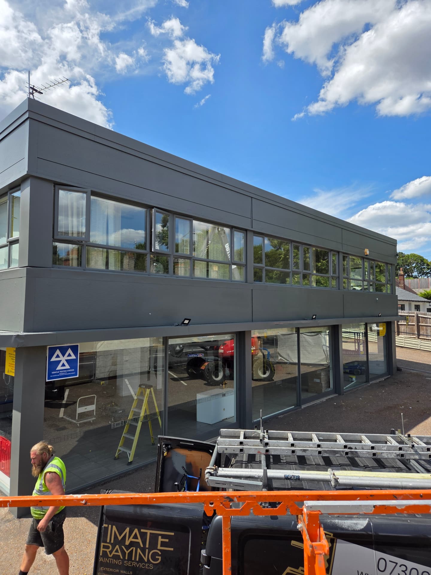 Company-supplied photograph: Ford showroom in Peterborough after cladding, windows and doors were resprayed in RAL 7005 mouse grey