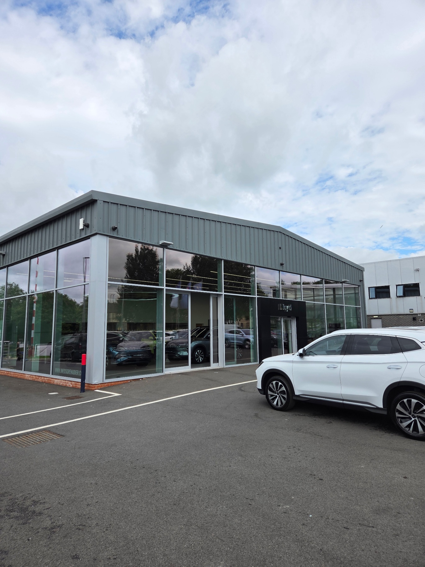 Completed Lloyd/INEOS showroom in Newcastle with RAL 7005 mouse grey cladding and glazed frontage