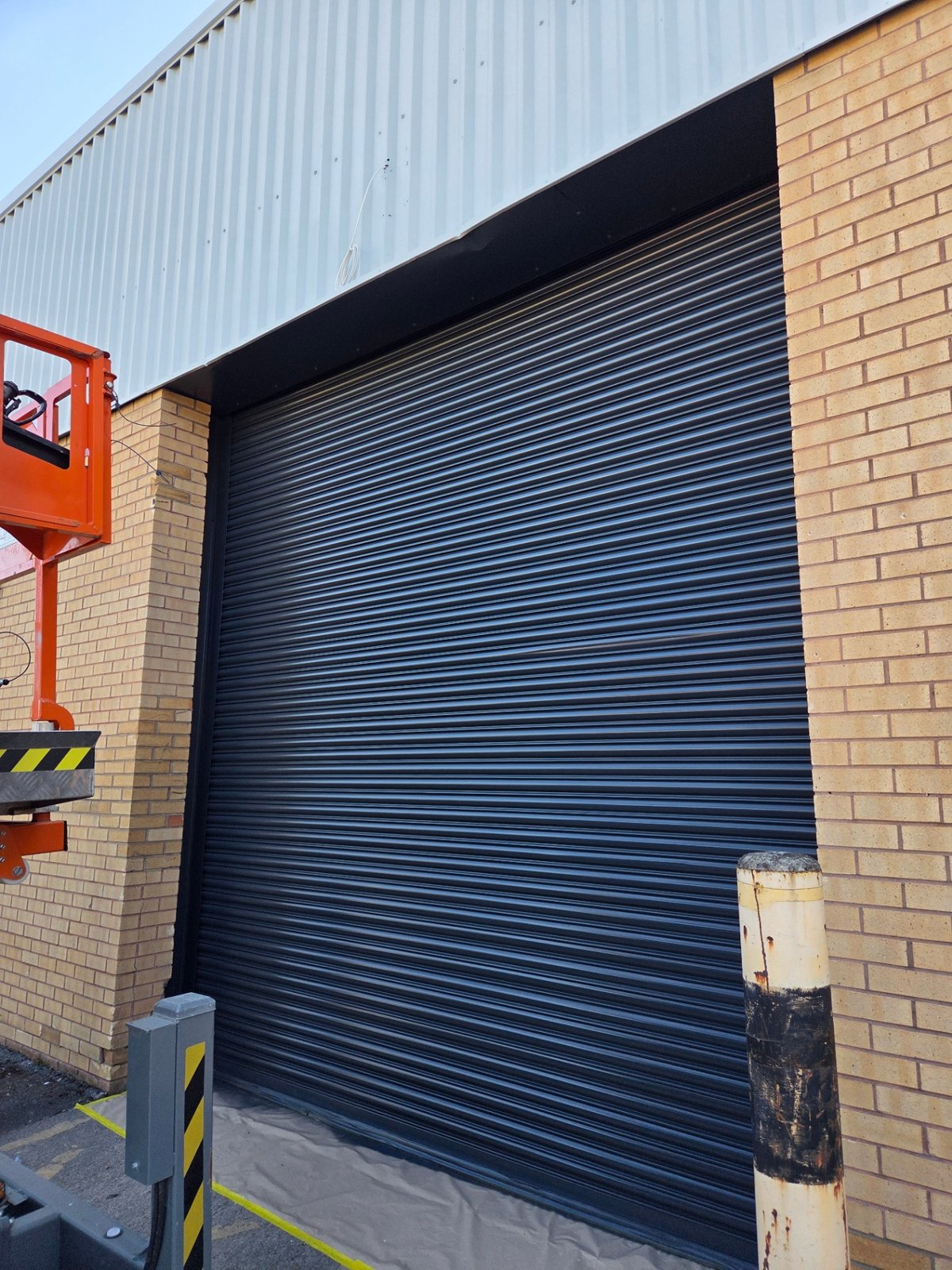 Company-supplied photograph: Close view of a Bradford roller shutter resprayed in RAL 7016 anthracite grey
