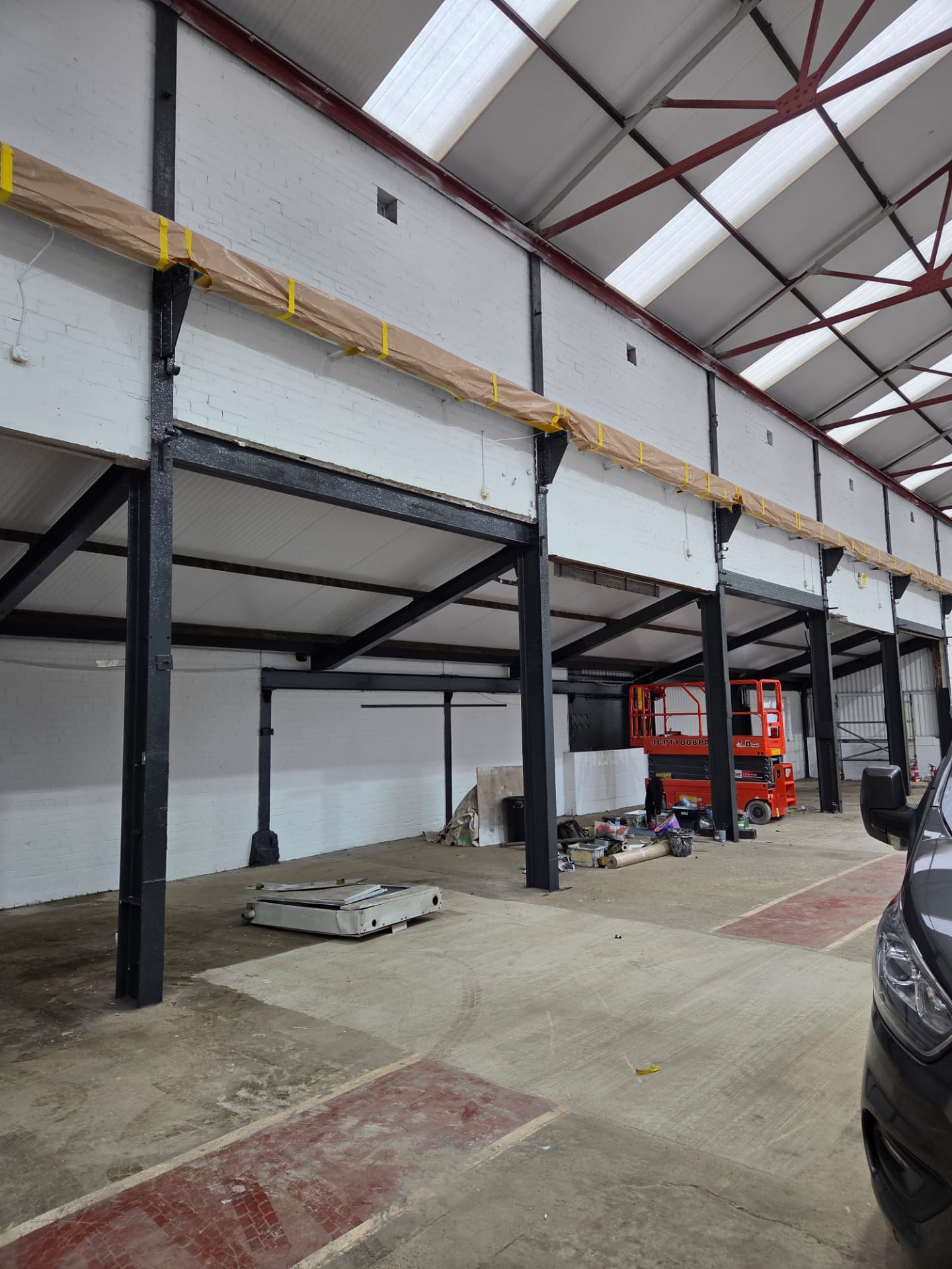 Company-supplied photograph: Wakefield warehouse with steelwork recoated black and walls finished white