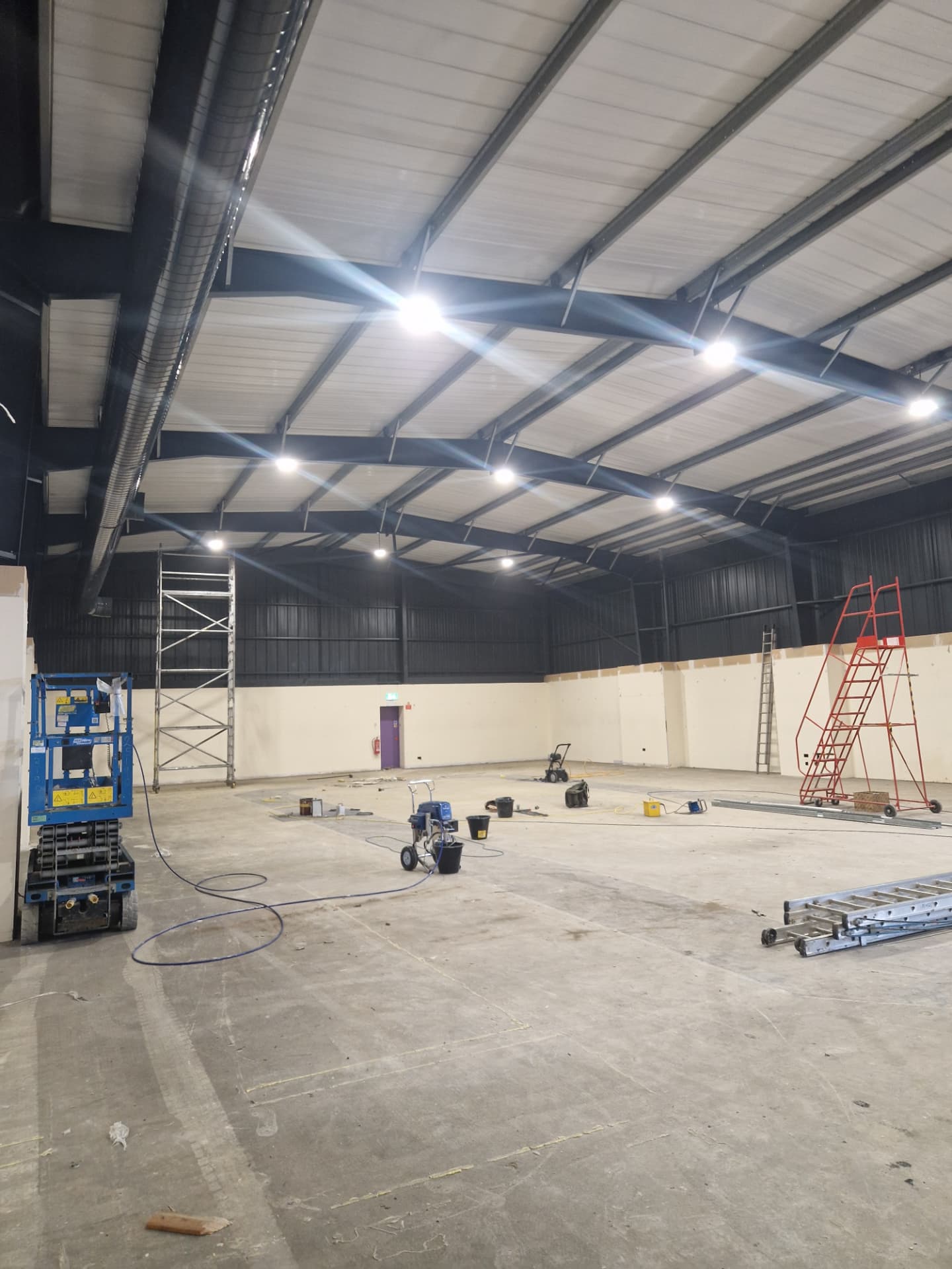 Company-supplied photograph of the X Martial Arts interior with roof cladding and ducting resprayed in RAL 7016 anthracite grey