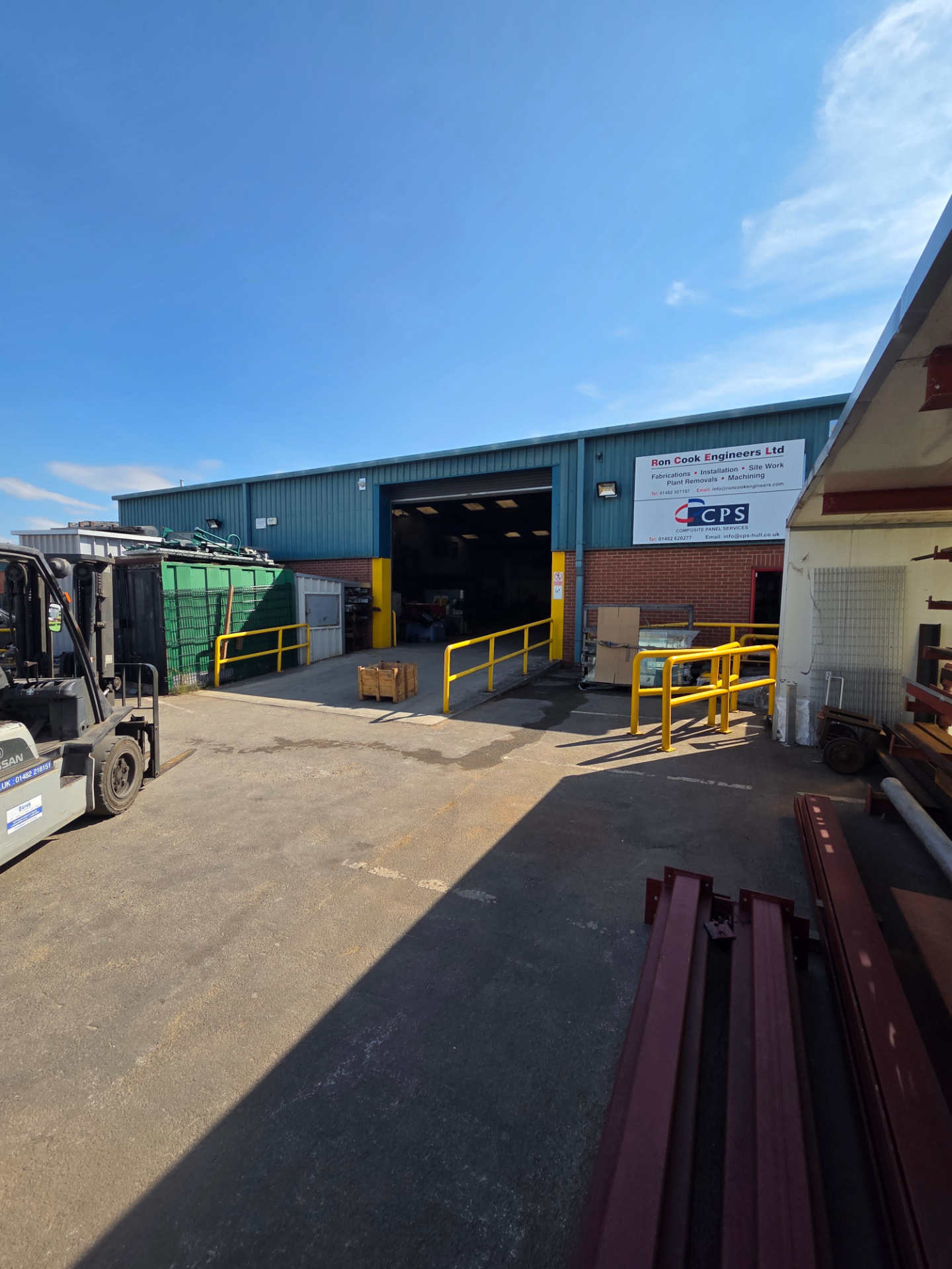 Company-supplied photograph: Ron Cook Engineers factory before respraying, with original green cladding