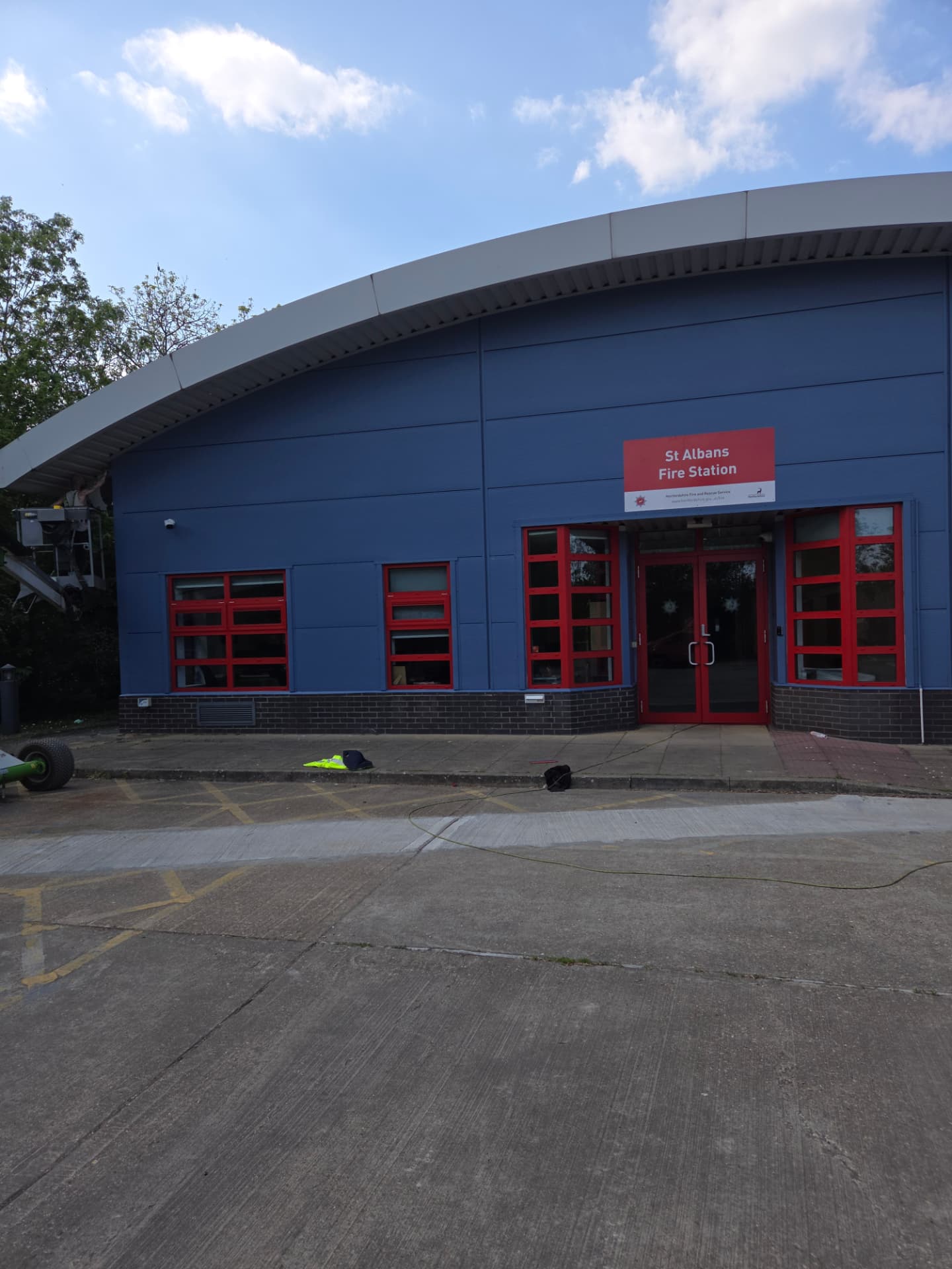 Company-supplied photograph of the completed St Albans Fire Station entrance with traffic red doors and signage