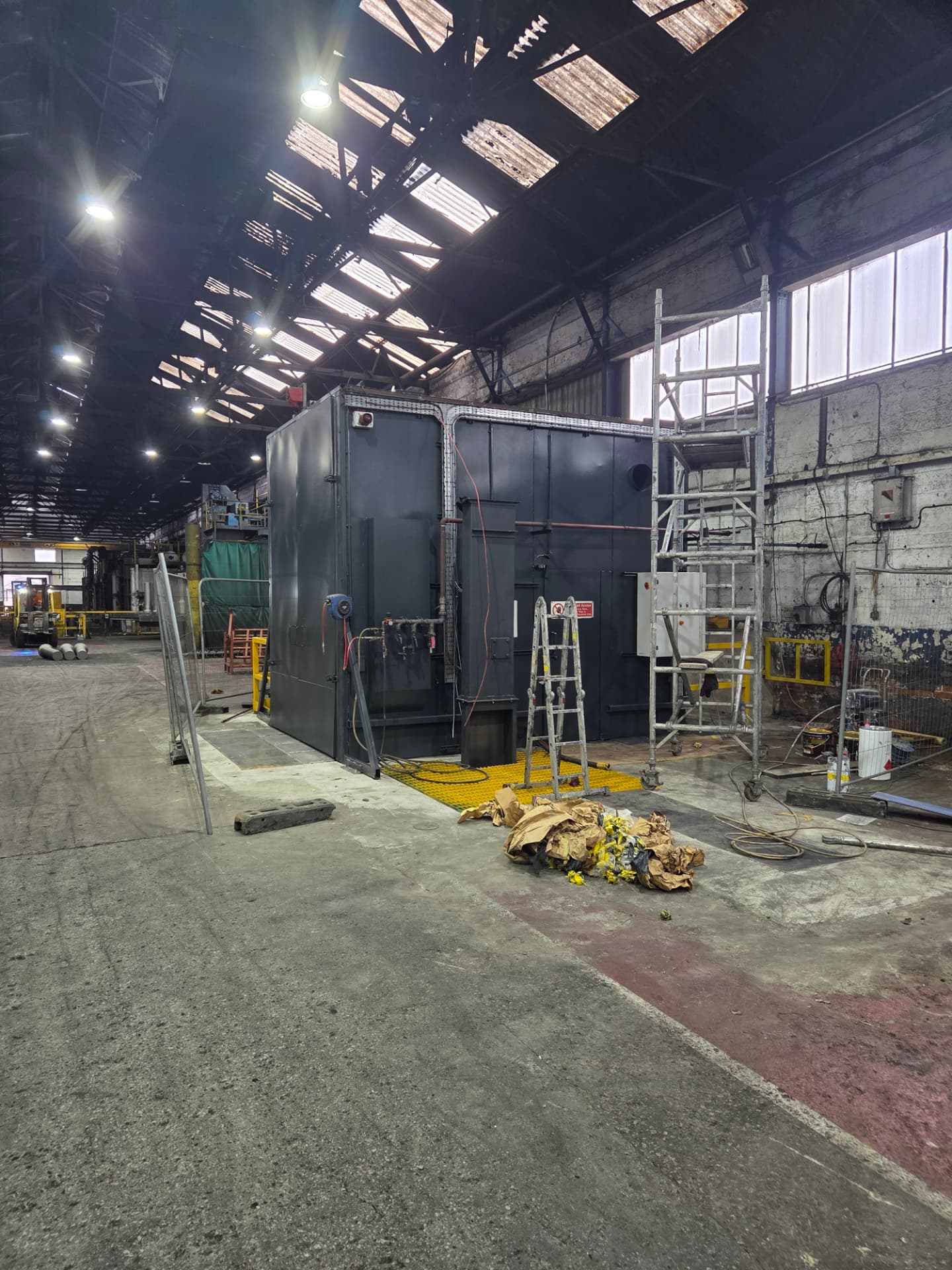 Company-supplied photograph: Forged Solutions silo and container after respraying in RAL 7016 anthracite grey