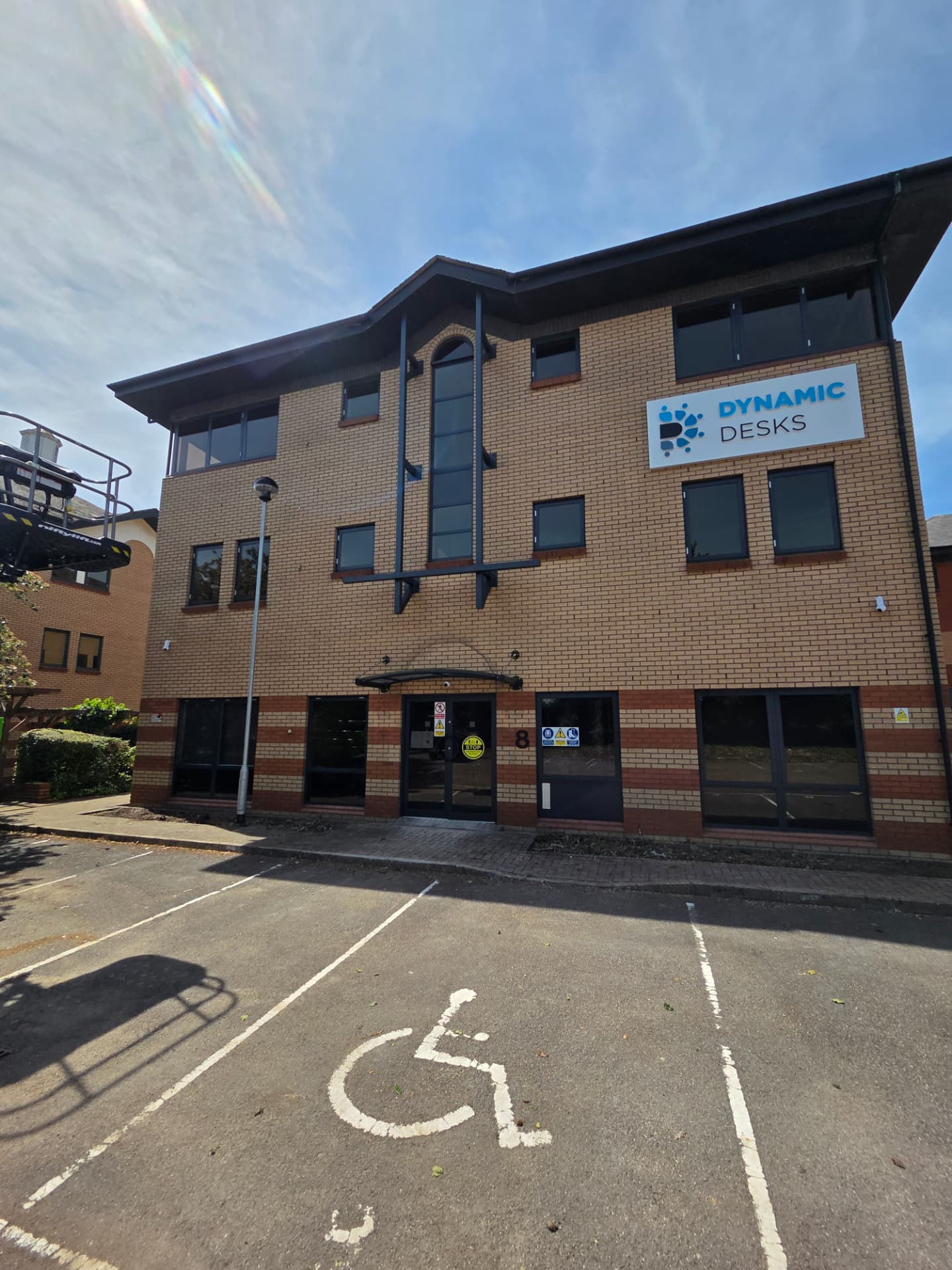Company-supplied photograph of the completed Dynamic Desks front elevation with anthracite grey windows and doors