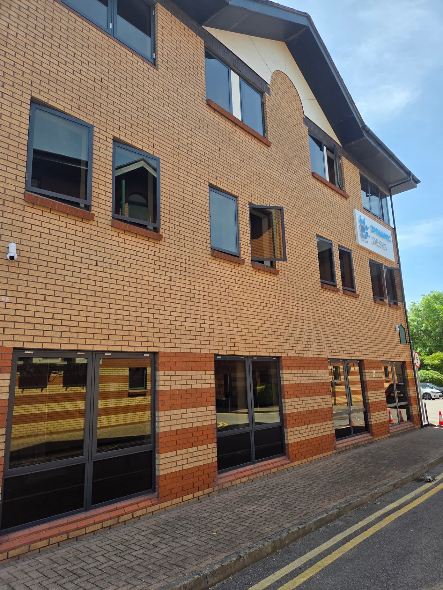Company-supplied photograph of completed Dynamic Desks side-elevation windows and doors in RAL 7016 anthracite grey
