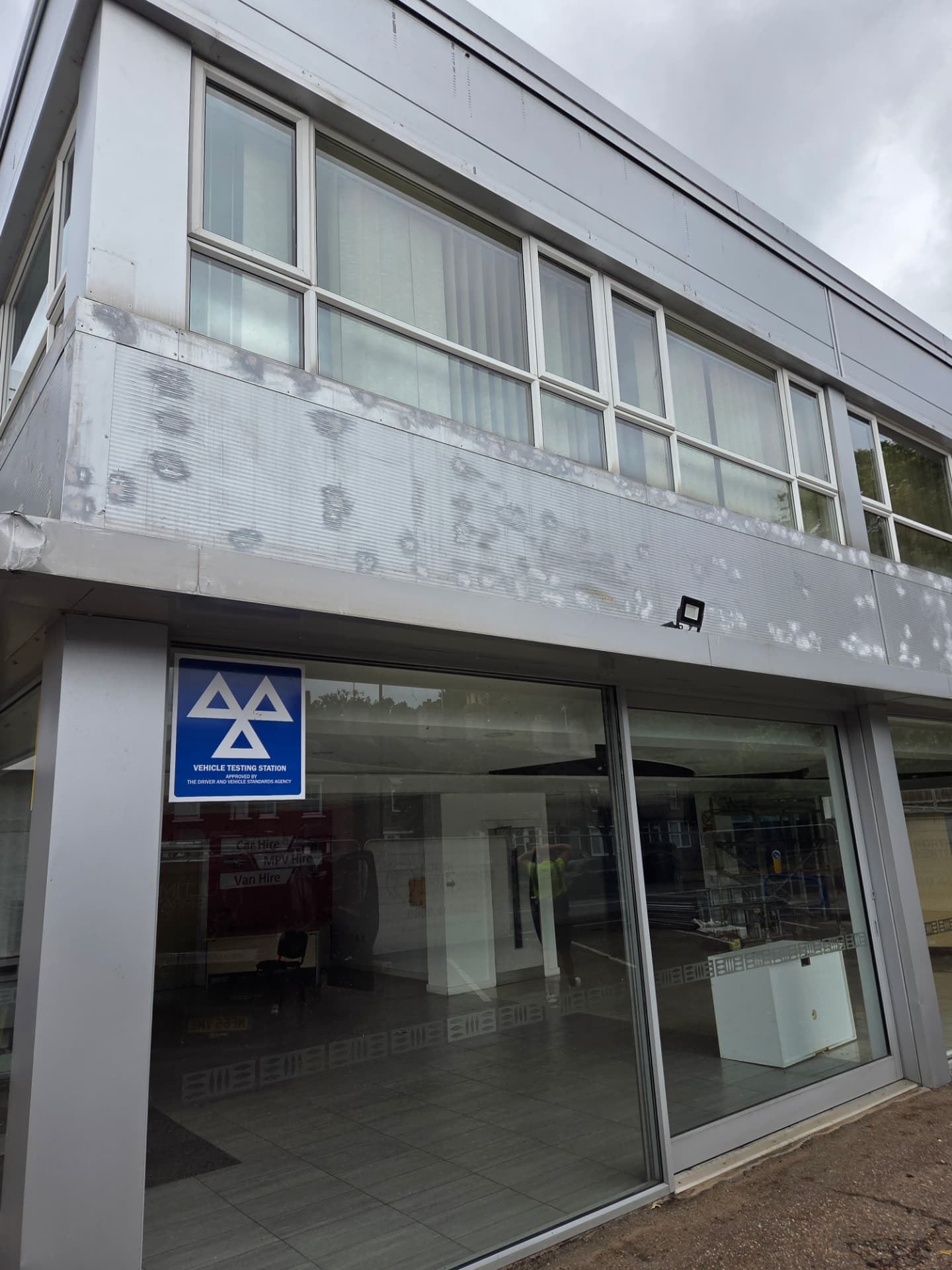 Company-supplied photograph of the Ford showroom original light grey panels and glazing