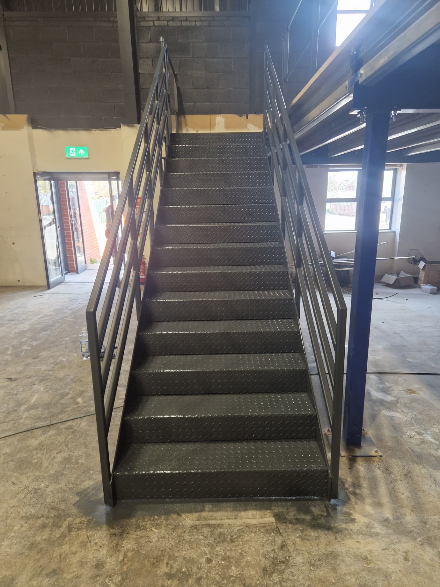 Company-supplied photograph of the X Martial Arts staircase resprayed in RAL 7016 anthracite grey