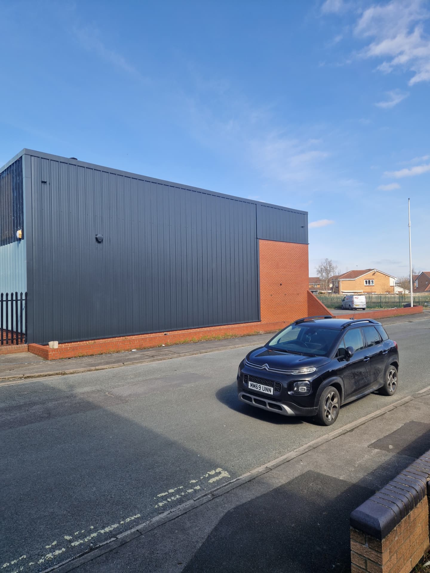 Company-supplied photograph of the completed X Martial Arts side elevation in anthracite grey